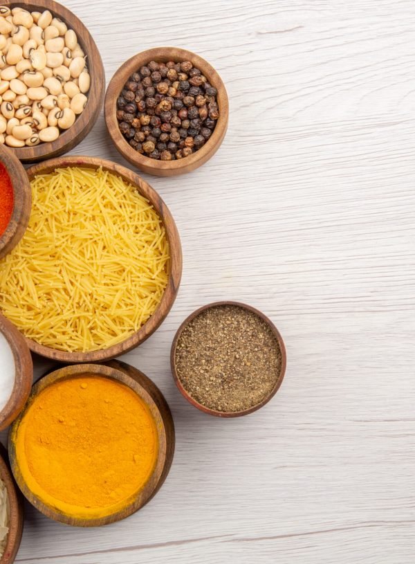 top-view-wooden-bowls-with-beans-table-with-free-space